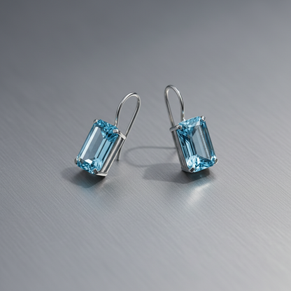 Earrings on metallic surface